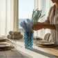 Mellow Monkey Bossanova Aqua Venetian Crystal Vase with blue and green mosaic pattern, 8-inch height, holding dried flowers.