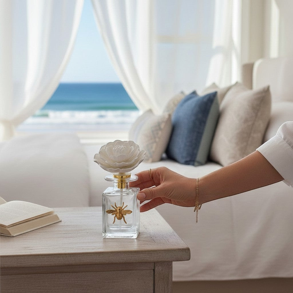 Mellow Monkey Apothecary Guild Botanical Oasis diffuser with bee accent, white floral top, and Black Fig Vetiver scent.