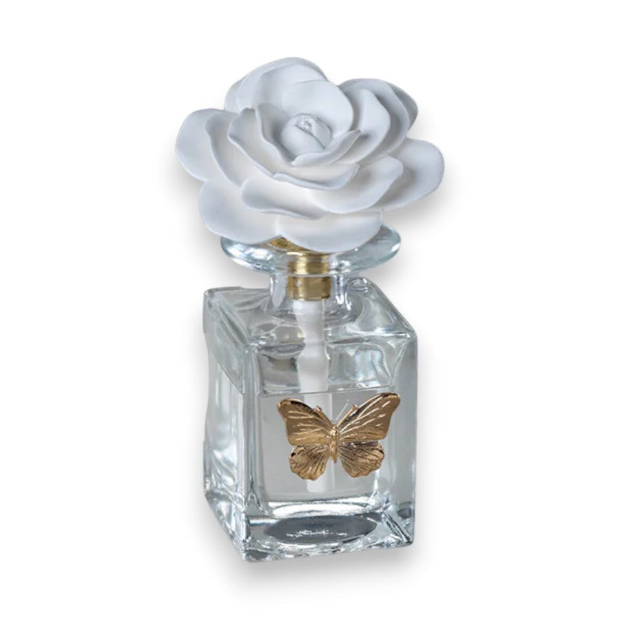 Mellow Monkey Apothecary Guild Botanical Oasis diffuser with butterfly accent and white rose topper. Black Fig Vetiver scent.