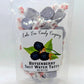 Mellow Monkey Boysenberry Salt Water Taffy, individually wrapped purple candies with a sweet berry flavor and melt-in-your-mouth texture.