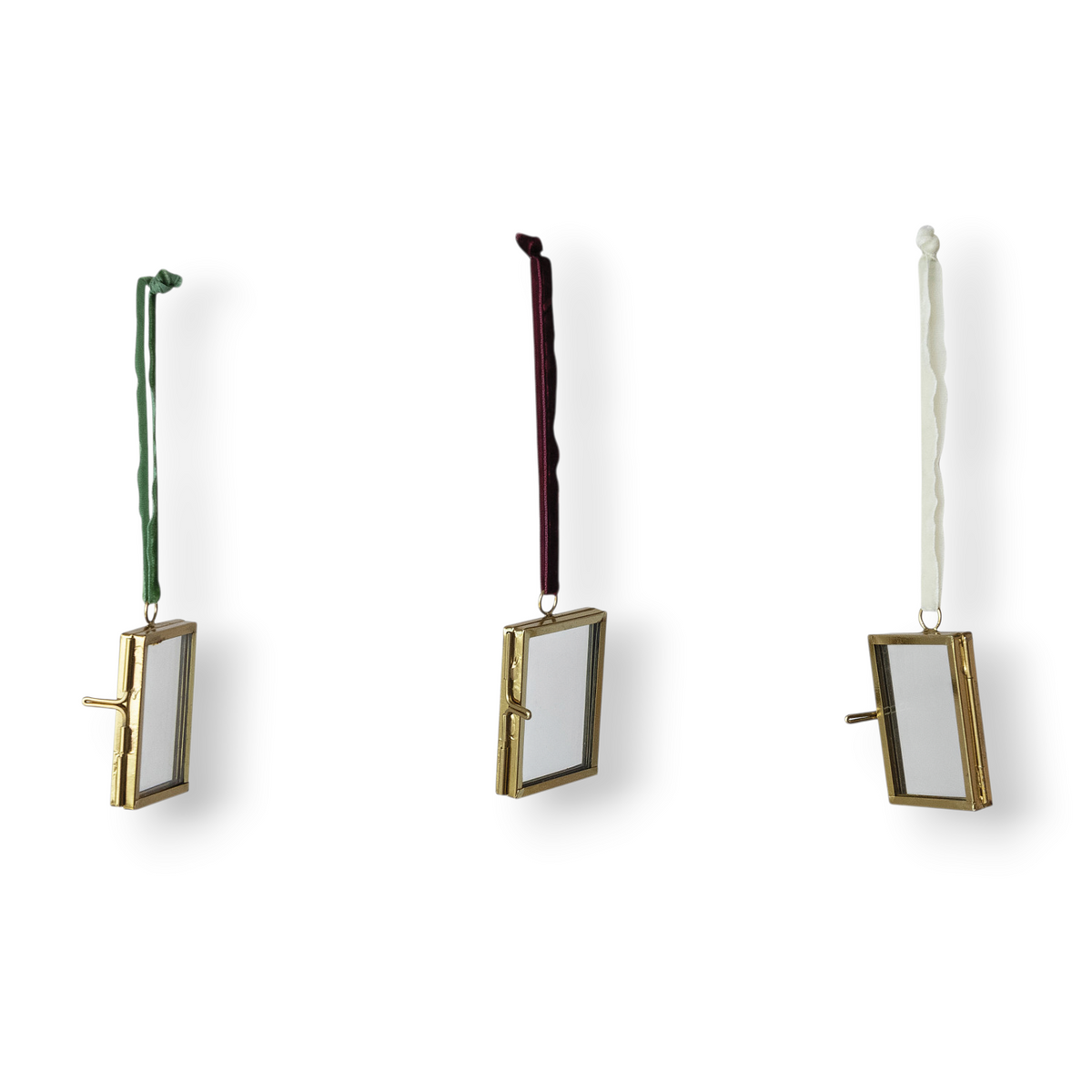 Mellow Monkey brass and glass photo frame ornaments with red, green, and white velvet ribbon hangers