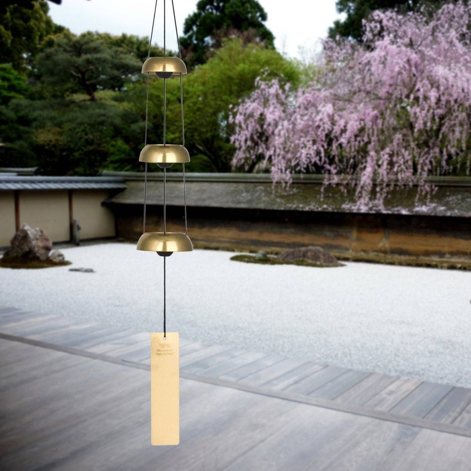 Mellow Monkey minimalist brass-toned metal wind chime with three graduated domes and a rectangular wind catcher