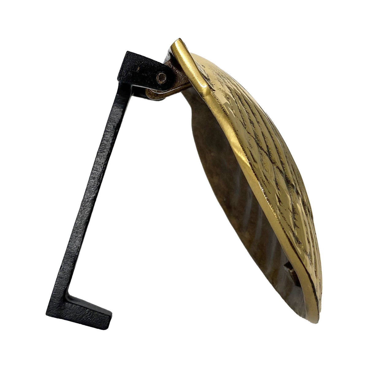 Mellow Monkey solid cast brass scallop shell door knocker shown from a side profile view.