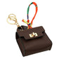 Mellow Monkey brown faux leather mini handbag keychain with gold clasp and colorful scarf accent.