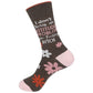Mellow Monkey brown crew socks with floral pattern, blush pink heel and toe, and sarcastic text in white and pink.