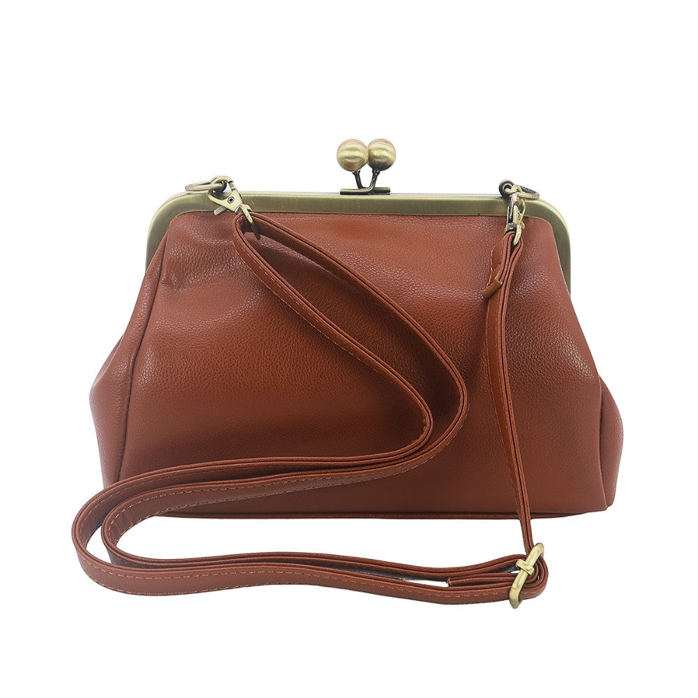 Mellow Monkey brown vinyl kisslock bag with a vintage-inspired structured silhouette and detachable crossbody strap.