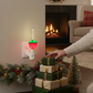 Mellow Monkey traditional bubble light night light with red and green base glowing in a festive holiday living room.
