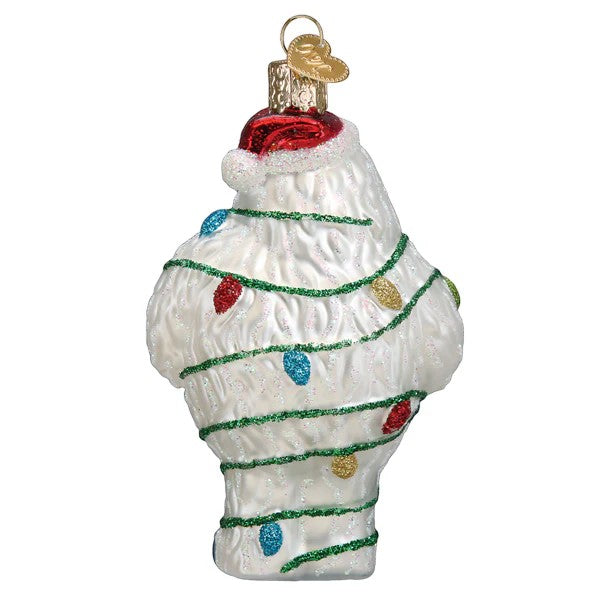 Mellow Monkey Bumble the Abominable Snow Monster Christmas ornament, white glass with red Santa hat and colorful lights.