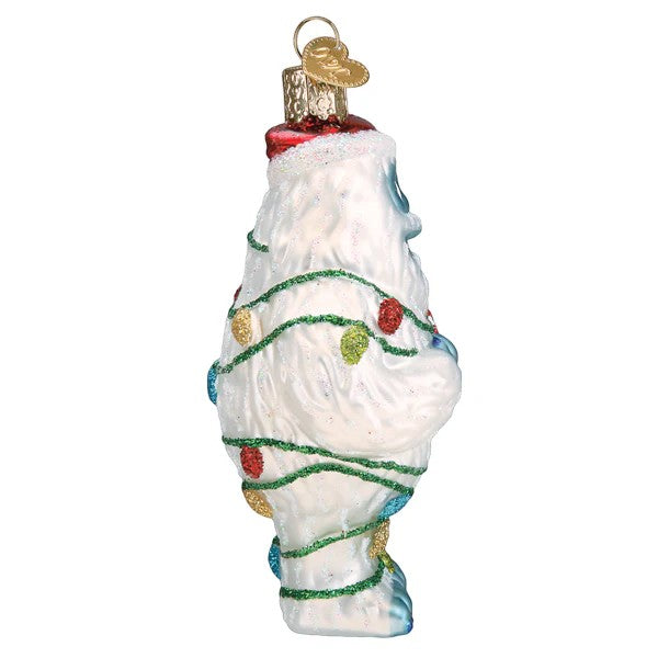 Mellow Monkey Bumble the Abominable Snow Monster Christmas ornament, white glass with colorful lights and Santa hat.