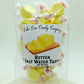 Mellow Monkey Butter Salt Water Taffy, individually wrapped yellow candies with a rich, buttery flavor and chewy texture.