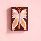 Mellow Monkey Together Tile Acrylic Wall Art, 5x7 inch, featuring a colorful butterfly design with pink, orange, and cream layered paper.