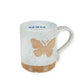 Mellow Monkey speckled stoneware mug featuring a hand-carved butterfly design and Follow Your Bliss quote inside.