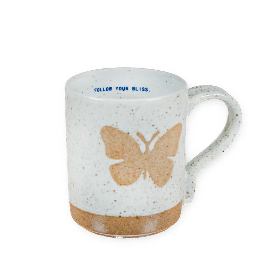 Mellow Monkey speckled stoneware mug featuring a hand-carved butterfly design and Follow Your Bliss quote inside.