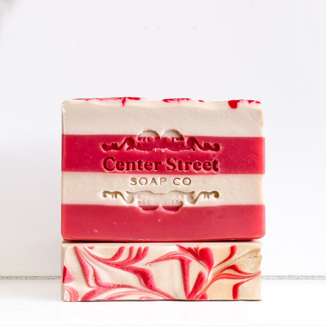 Mellow Monkey Candy Cane Christmas vegan handmade bar soap with red and white peppermint stripes and embossed logo.