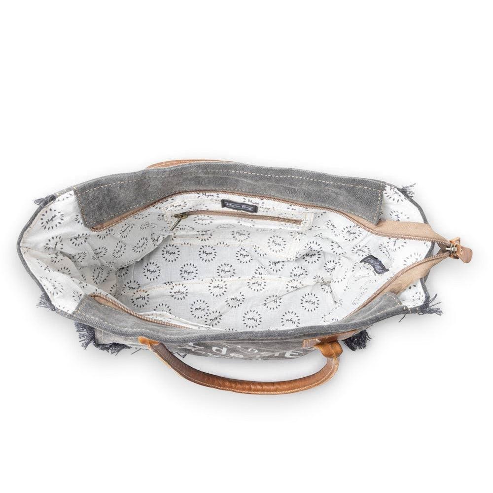 Mellow Monkey Hazy Tones canvas and leather crossbody bag interior view with zippered pocket and patterned lining