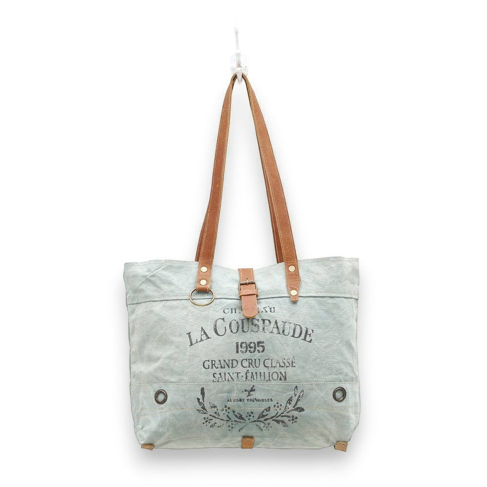 Mellow Monkey La Couspaude canvas tote bag with brown leather handles and vintage wine label print
