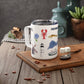 Mellow Monkey 12oz insulated stainless steel mug featuring whimsical Cape Cod coastal illustrations on a white background.