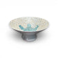 Mellow Monkey 14-inch capiz shell pedestal bowl featuring a shimmering white finish and a blue mosaic starfish center.