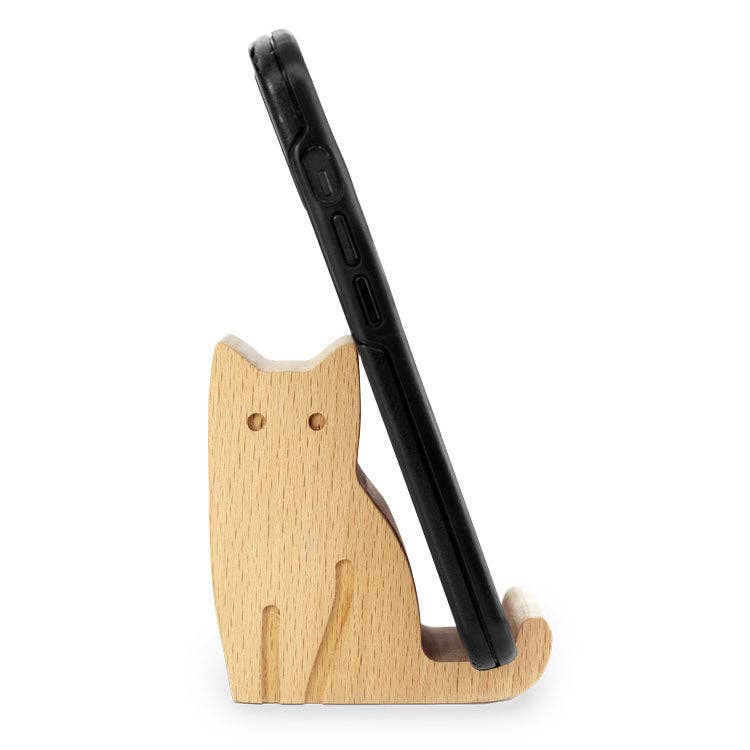 Mellow Monkey cat-shaped beechwood phone stand holding a black smartphone in profile view