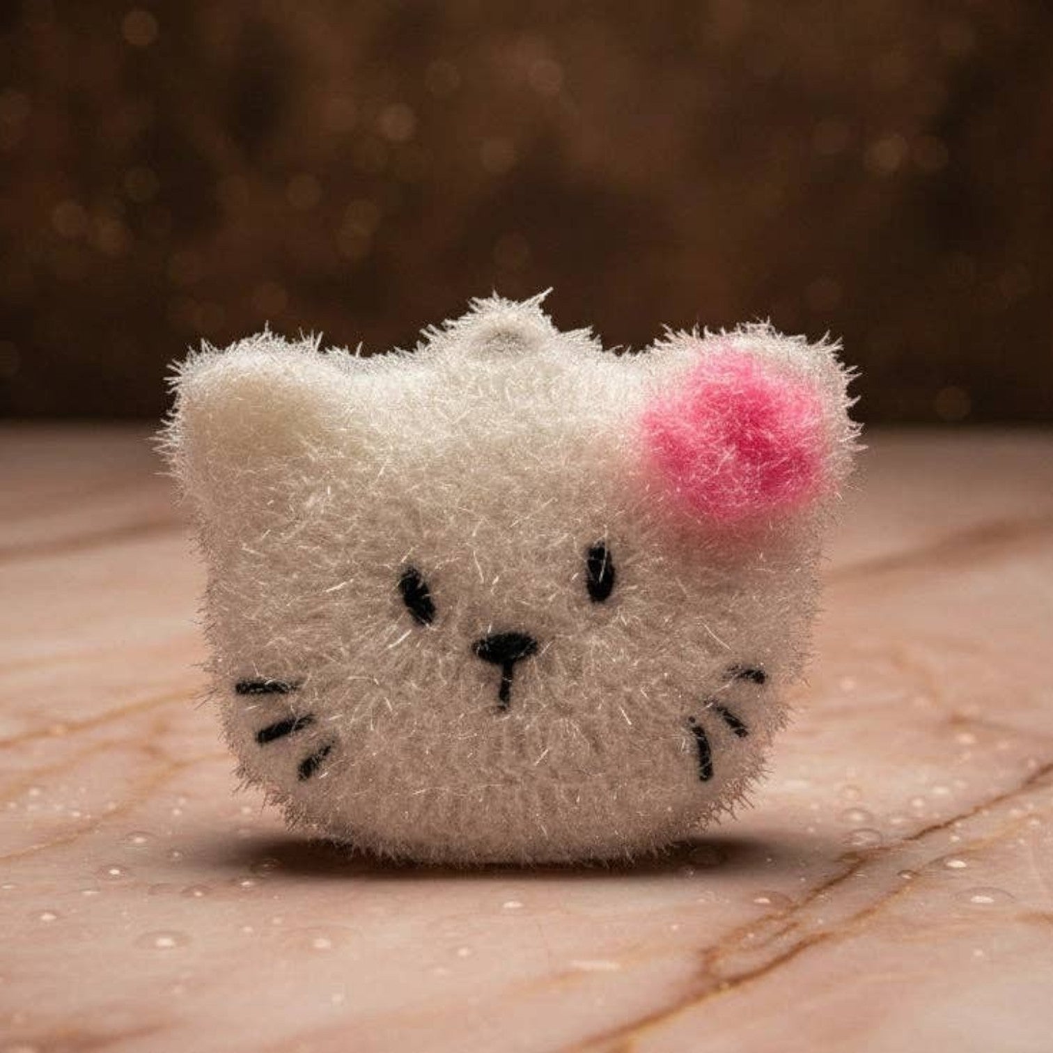 Mellow Monkey Pearl cat dish scrubber, white with pink bow, scrubby and soft sides for cleaning.