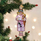 Mellow Monkey Cat Lady glass ornament with cats, holding a mug that says CATS. Pink robe, slippers, glasses.