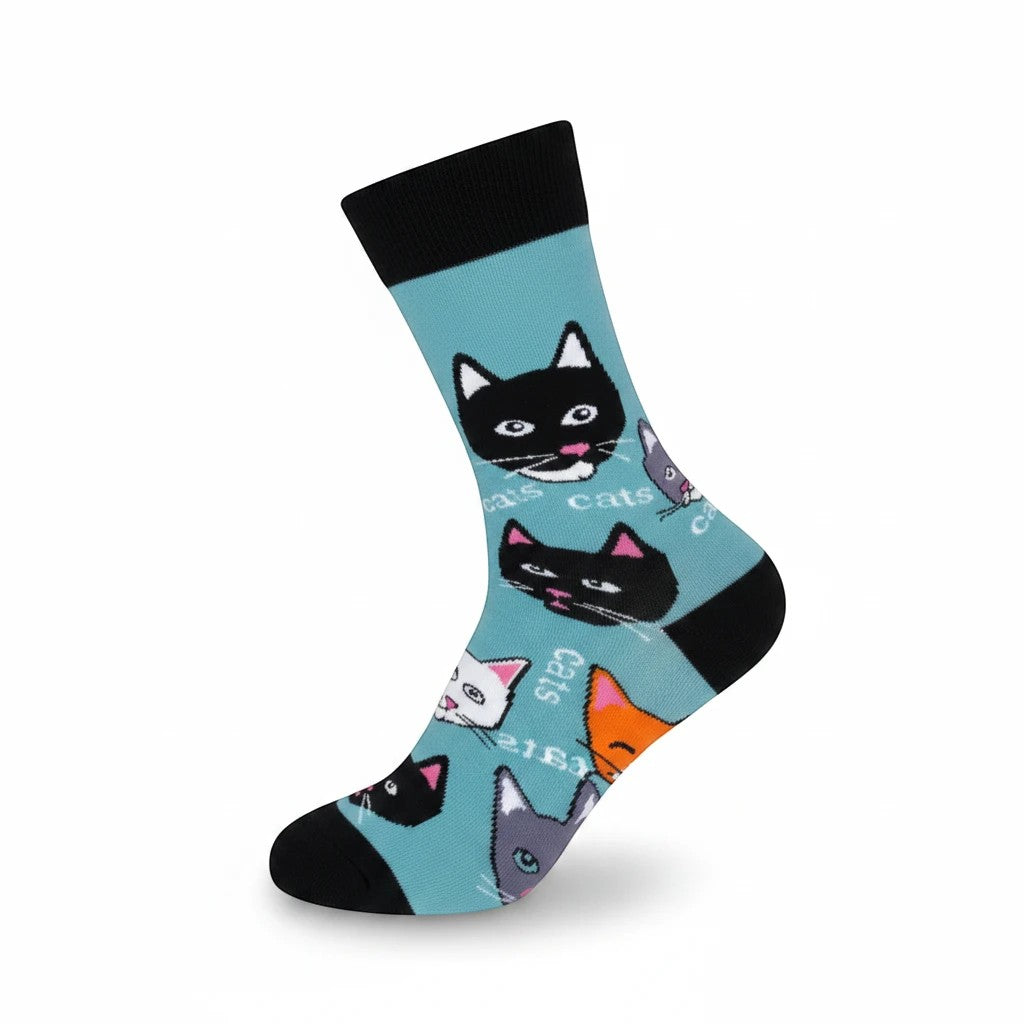 Mellow Monkey light blue crew socks featuring a repeating pattern of cartoon cat faces and the word Cats