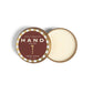 Mellow Monkey Wood Aromatics cedar wood hand salve in a 2 oz round metal tin with a maroon and gold striped lid