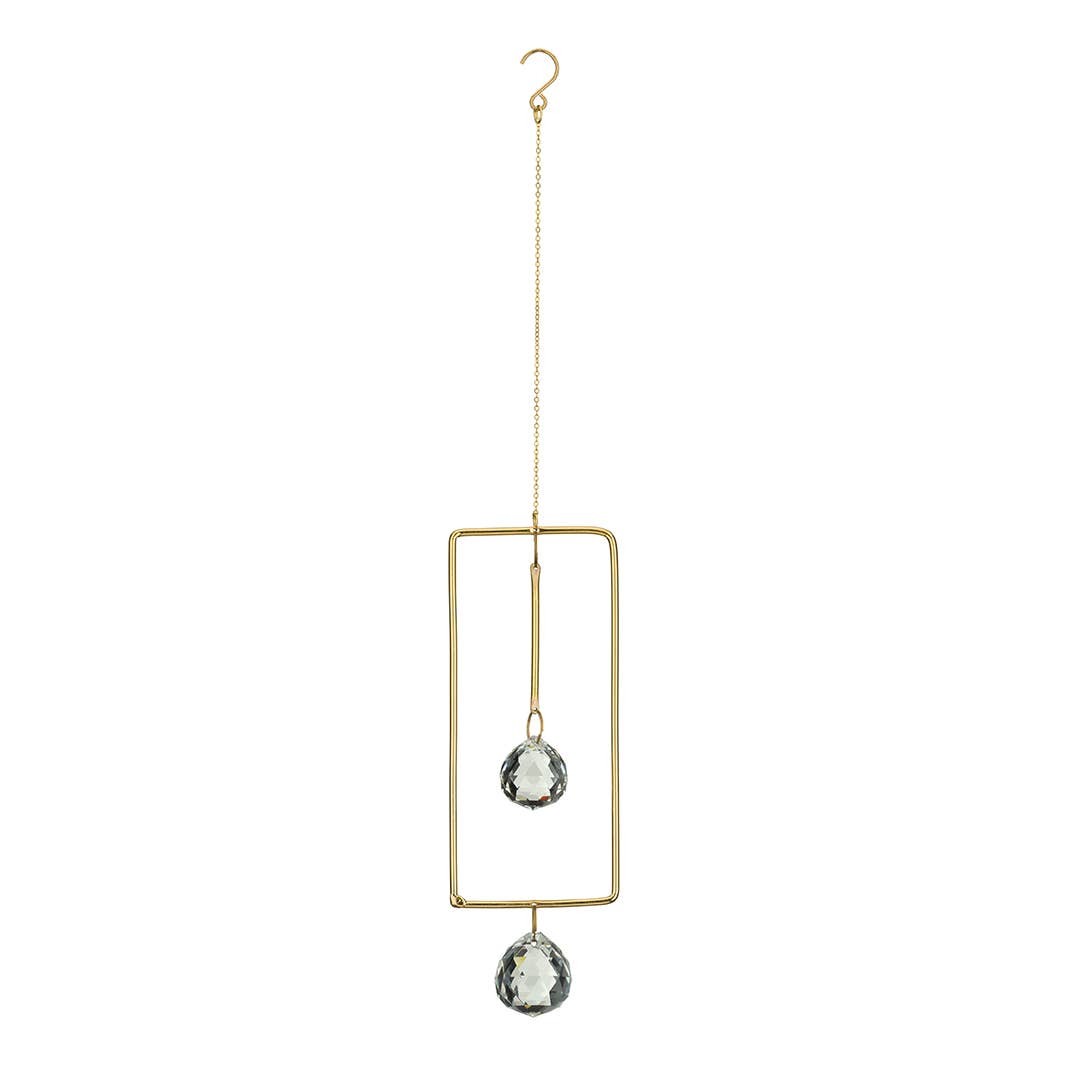 Mellow Monkey celestial suncatcher with bronze wire frame, gold chains, and two hanging clear crystals.