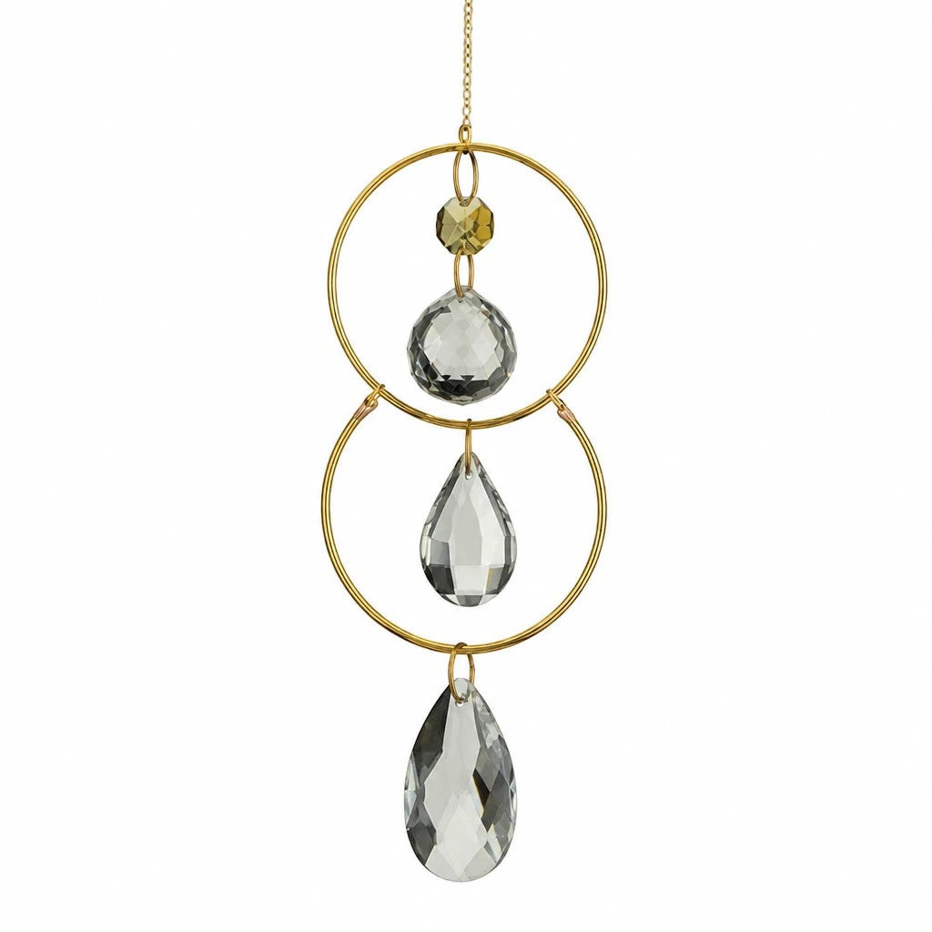 Mellow Monkey celestial suncatcher with gold rings, metallic chains, and clear faceted crystals for window decor.