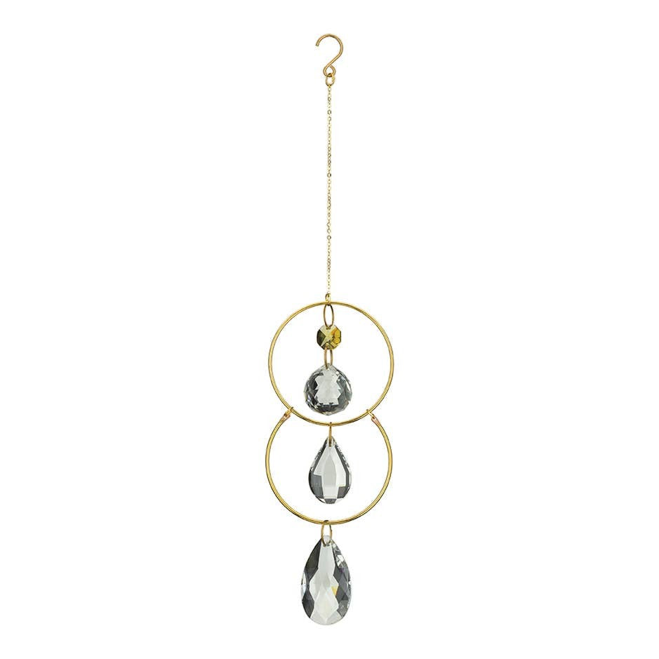 Mellow Monkey celestial suncatcher featuring gold rings, metallic chains, and hanging clear crystals for window decor.
