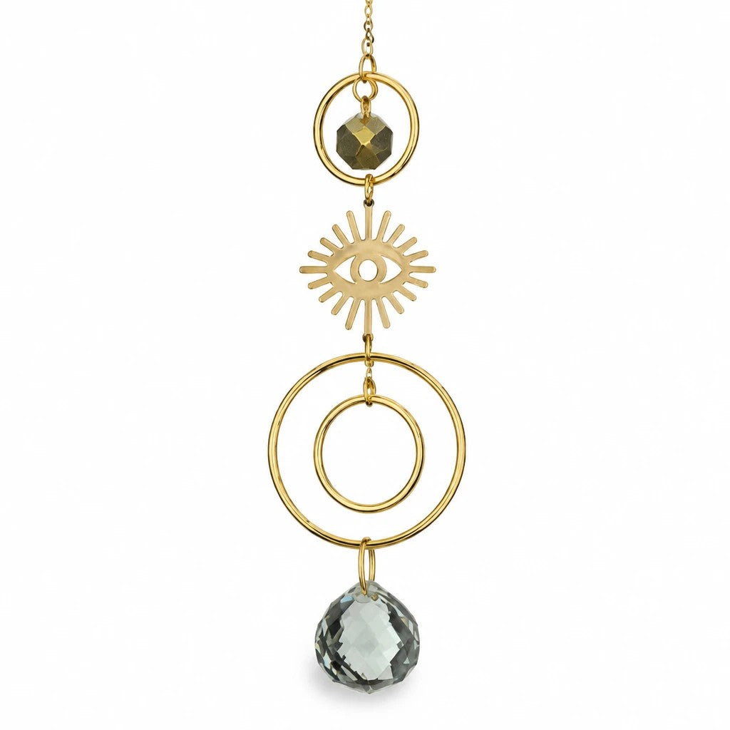 Mellow Monkey celestial eye suncatcher with gold-tone metal rings, bronze wire, and sparkling light-catching crystals.