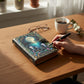Mellow Monkey Celestial Ocean handmade leather spellbook with moonlit ocean scene and jellyfish, 5x7 inches.