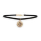 Mellow Monkey black velvet choker with a gold celestial sun and moon charm pendant for a chic, adjustable fit.