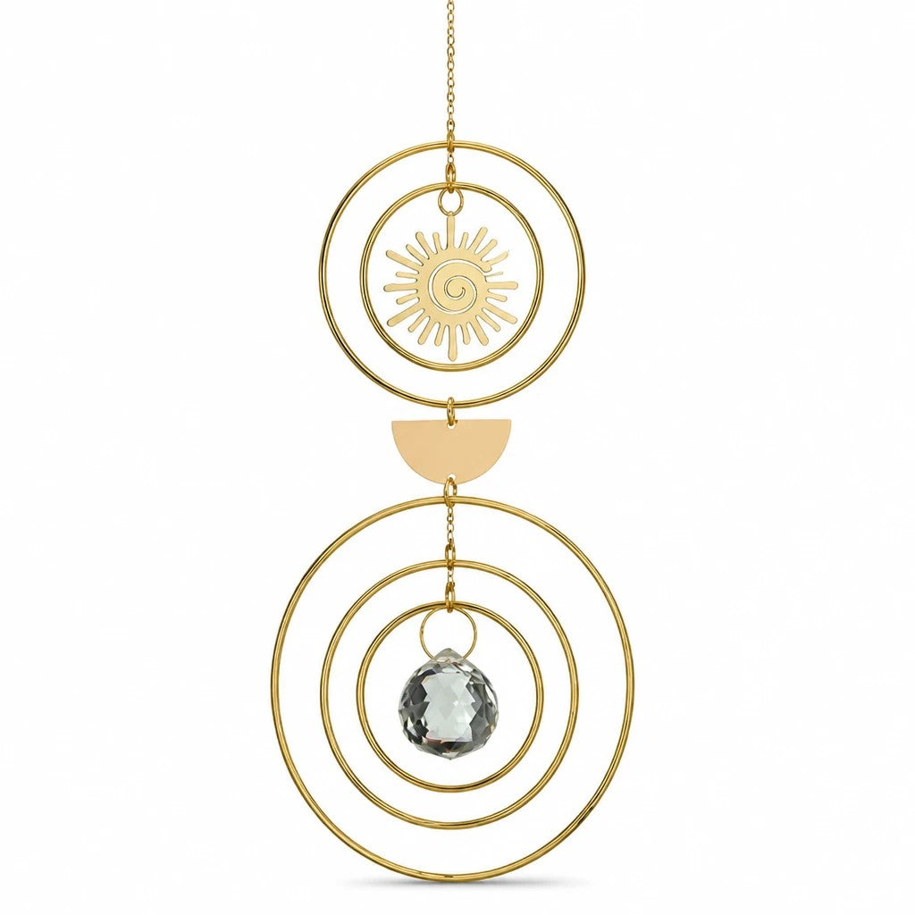 Mellow Monkey celestial suncatcher with gold rings, sun charm, and a hanging crystal prism for window decor.