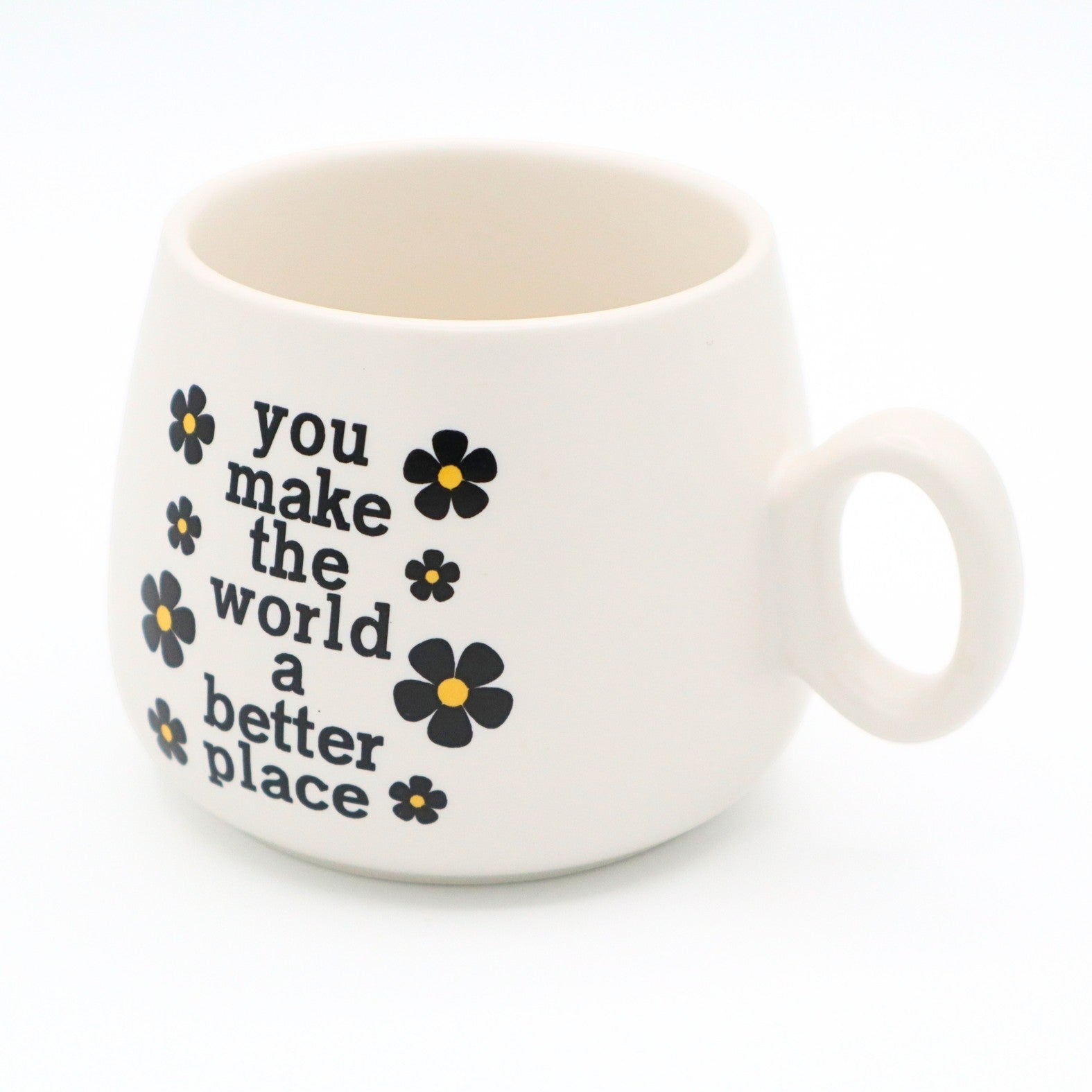 Mellow Monkey 11 oz ceramic cappuccino mug in cream with black floral accents and You Make The World A Better Place text