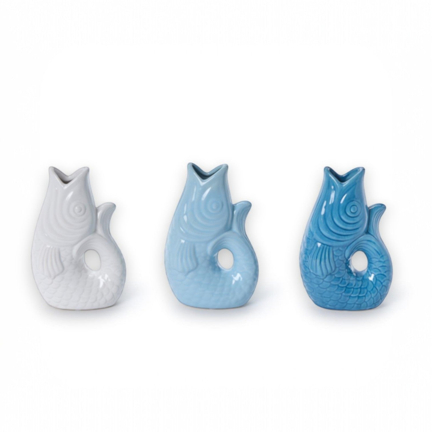Mellow Monkey small ceramic fish vase in white, seafoam, and blue. Handcrafted, 8-inch accent decor.