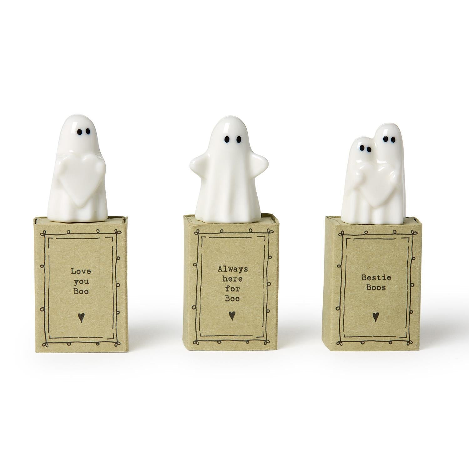 Mellow Monkey pocket-sized white ceramic ghost figurines with sentimental messages on individual kraft gift boxes.