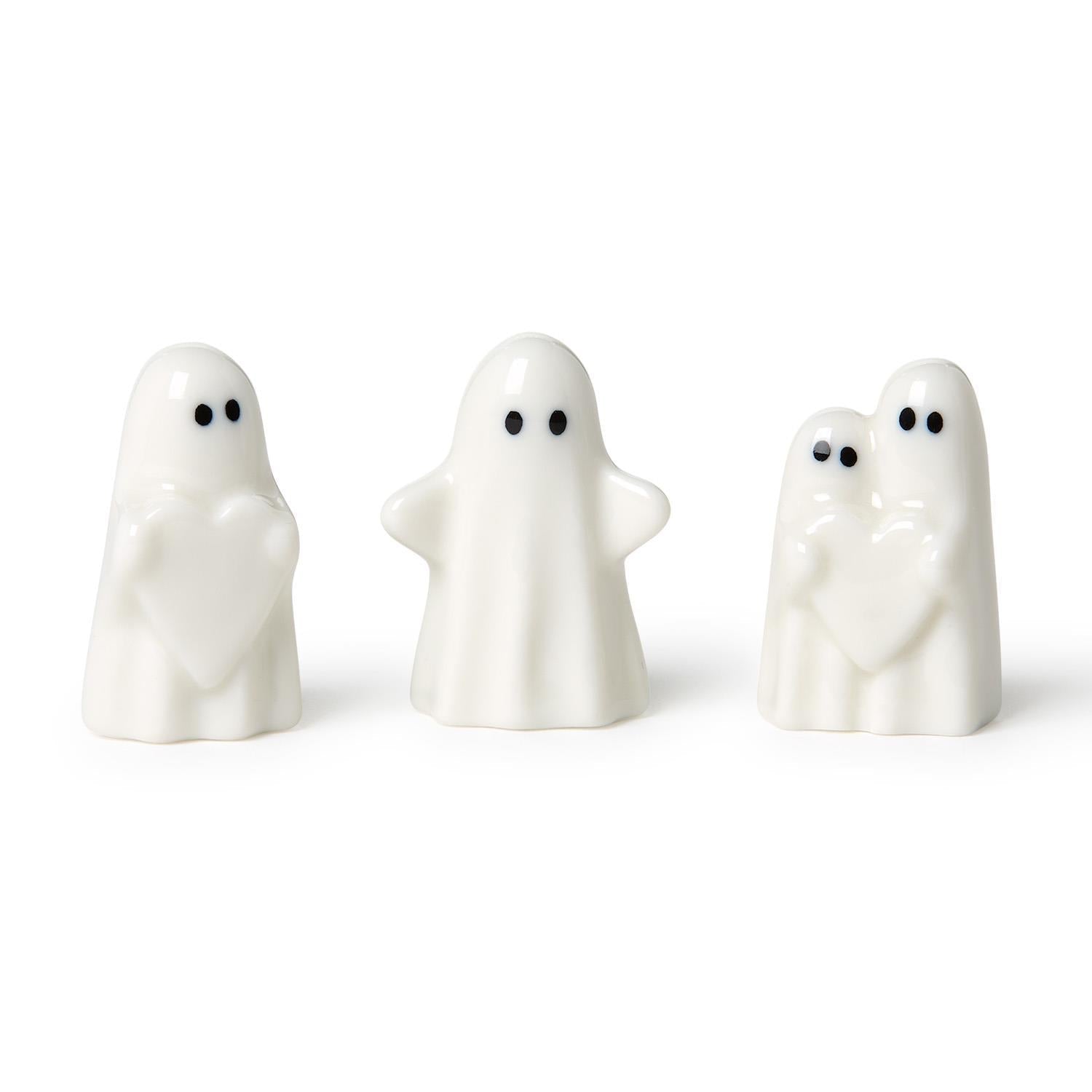 Mellow Monkey white ceramic ghost figurines featuring heart and hug designs for whimsical Halloween home decor.