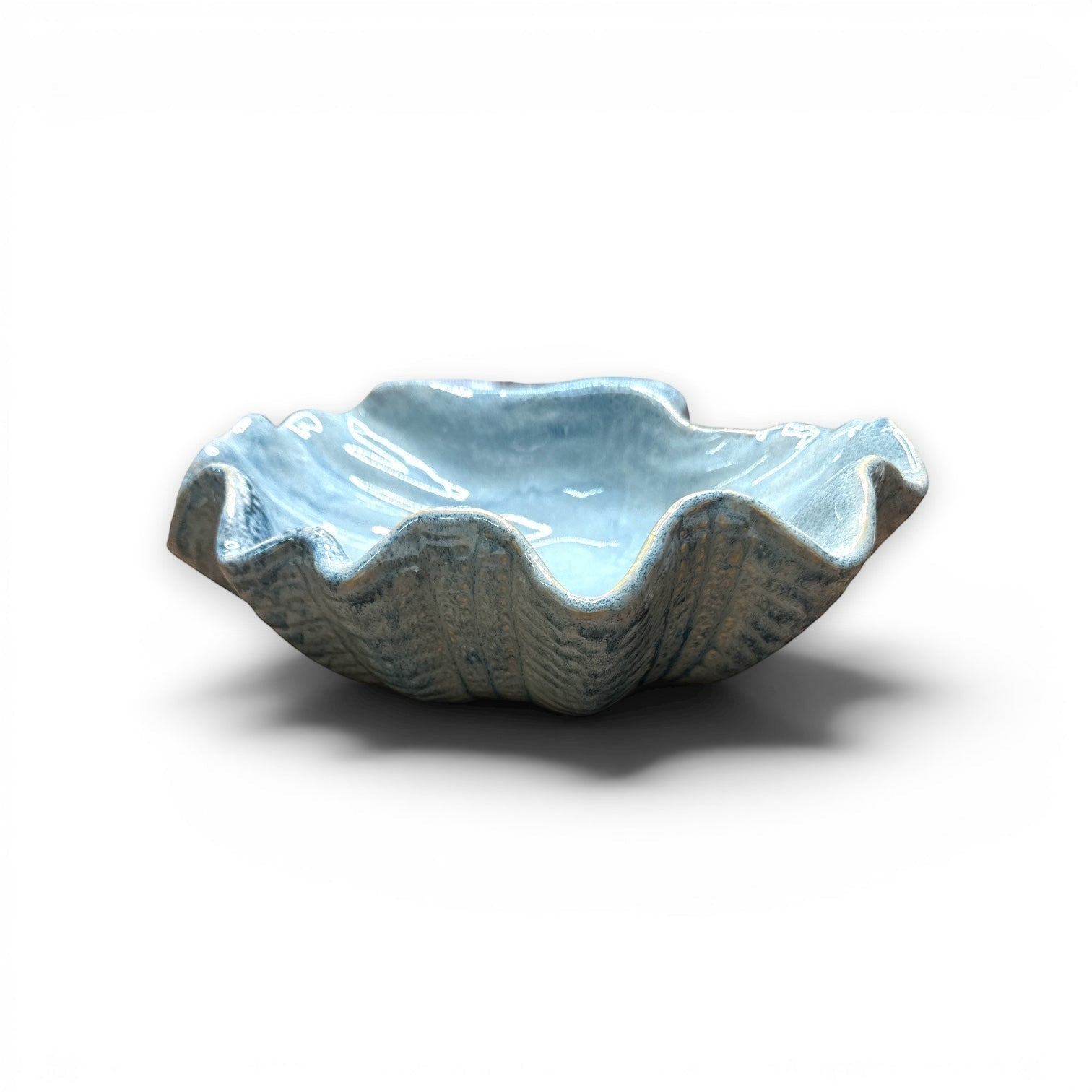 Mellow Monkey large ceramic shell bowl in dusty blue with a reactive glaze and organic clam shell silhouette.