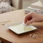 Mellow Monkey white ceramic trinket tray with gold trim, featuring yellow text quote: "I Choose My Friends Like My Cocktails... Strong, Fabulous & With A Twist."