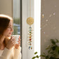 Mellow Monkey Chakras Daydream suncatcher with gold spiral, healing stones, and crystals hanging in a sunlit window.