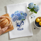 Mellow Monkey Chesapeake Blues flour sack towel featuring a blue hydrangea and crab vase print on white cotton.