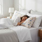 Mellow Monkey Silky Satin Pillowcase with a playful chicken pattern in pink, blue, yellow, and white. Smooth satin.