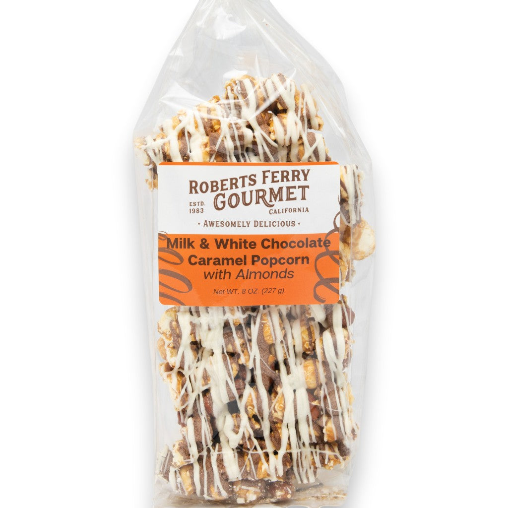 Mellow Monkey gourmet caramel popcorn with California almonds drizzled in milk and white chocolate in a clear bag.