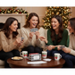 Four women laughing while playing Mellow Monkey Christmas movie trivia card game in a festive living room setting.