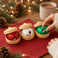 Mellow Monkey Christmas mystery squishy dumplings in festive containers, featuring reindeer, snowman, and elf designs.
