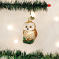 Mellow Monkey Christmas Owl blown glass ornament with gold and white feathers, perched on a green branch. 3 inches.