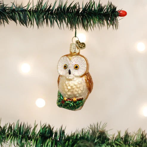 Mellow Monkey Christmas Owl blown glass ornament with gold and white feathers, perched on a green branch. 3 inches.