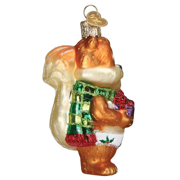 Mellow Monkey Silly Christmas Squirrel ornament, blown glass, wearing a green plaid scarf and white briefs with holly. Holding a gift.