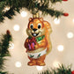 Mellow Monkey Silly Christmas Squirrel blown glass ornament holding a gift, wearing a green scarf and diaper.